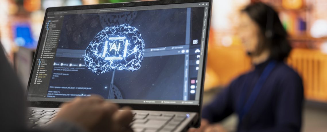 Call center worker uses AI technology on laptop to provide quick replies to common customer queries, close up. Customer service agent generates automated responses to clients using AI tech on notebook