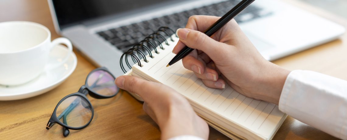 modern-female-writing-notepad