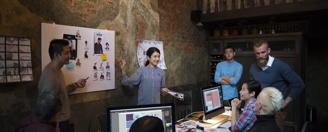 Group of creative people working and brainstorming together